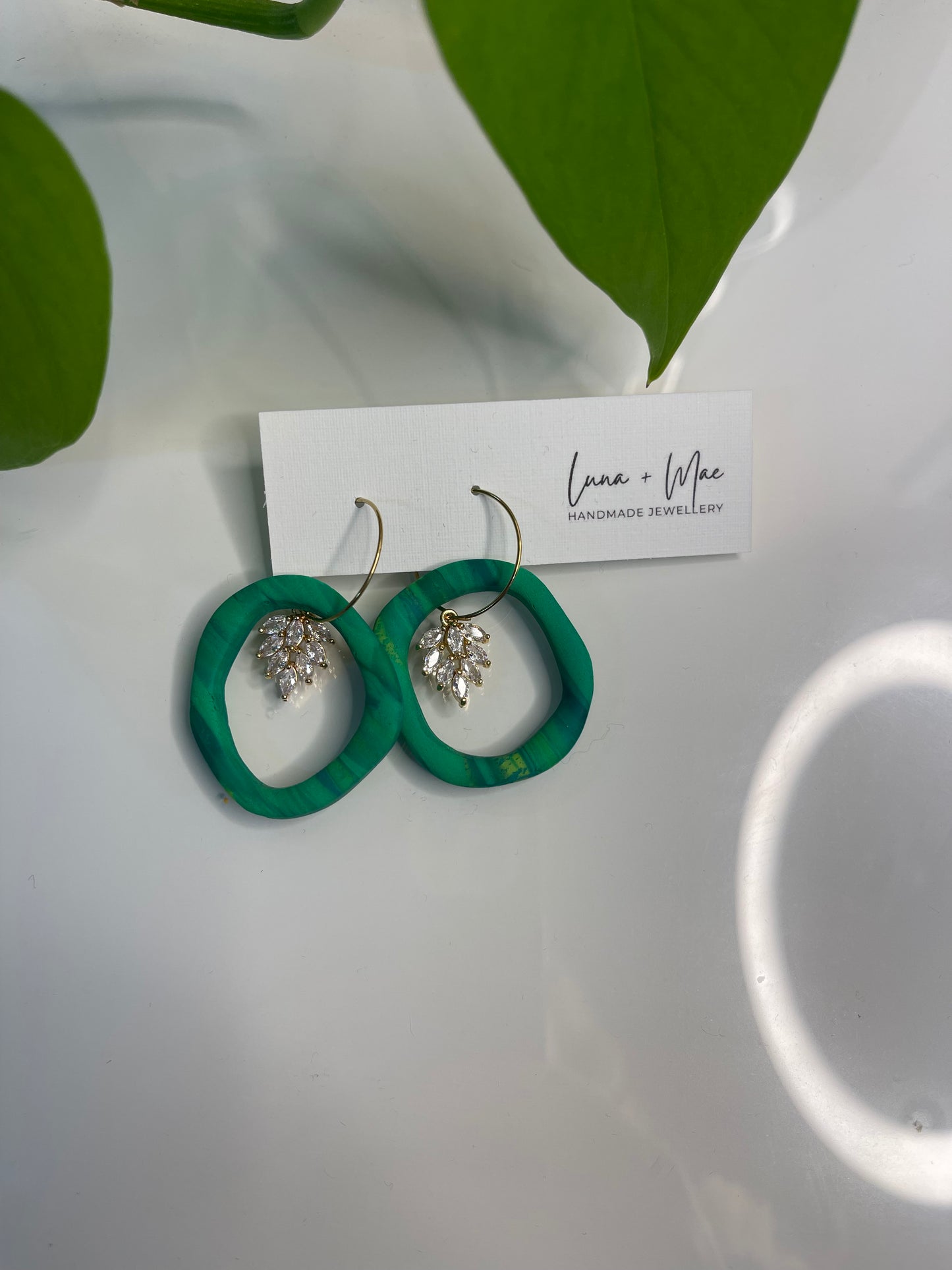 Green hoop dangle earring