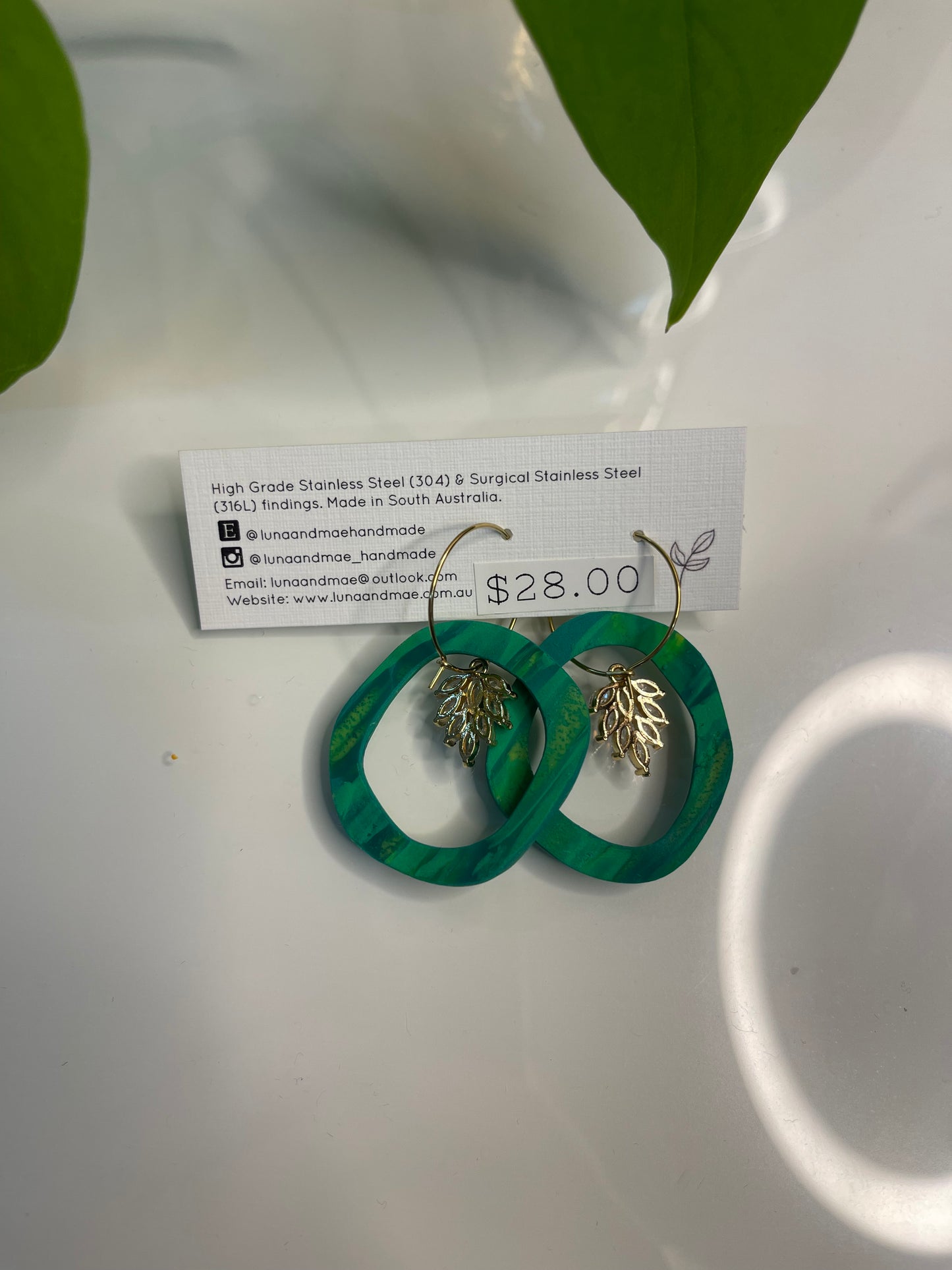 Green hoop dangle earring