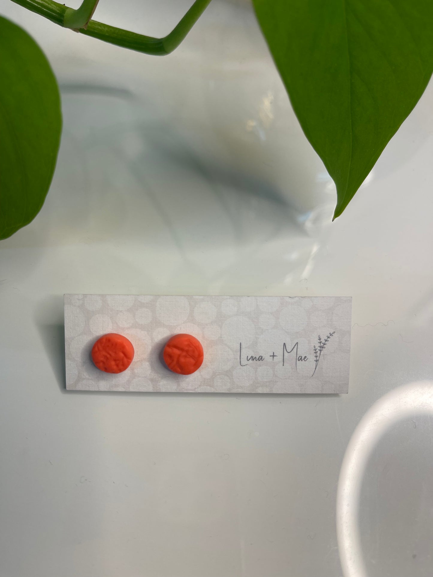 Orange stud earrings